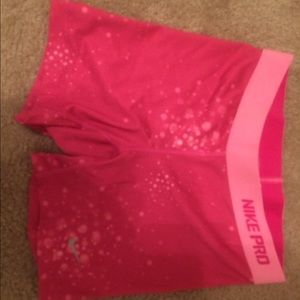 Pink nike pros. Youth large.