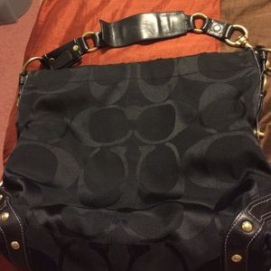 Black coach bag with C's all over