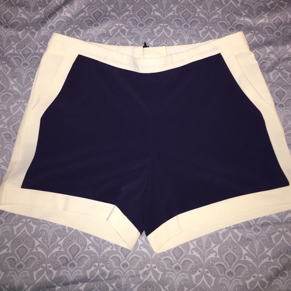 Shorts dark blue with cream on sides.