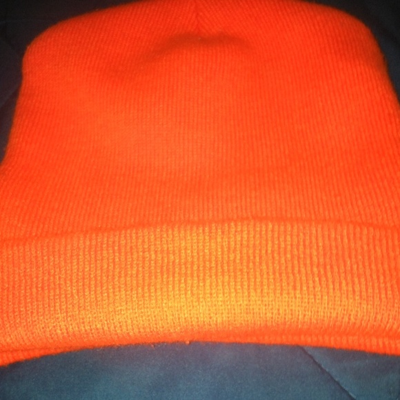 A neon orange beanie never worn
