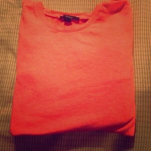 An orange FOREVER 21 sweater .
