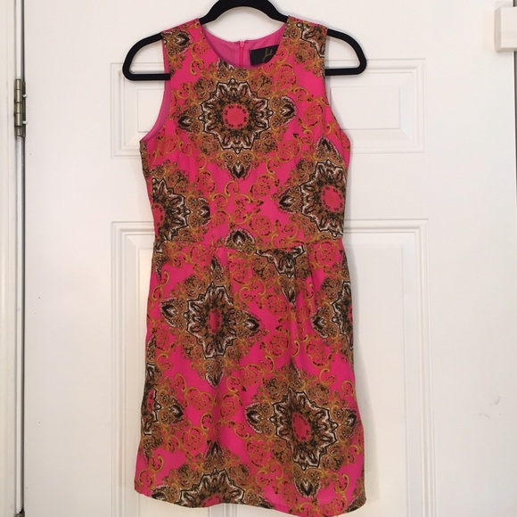 Pink dress with gold and black patterned details
