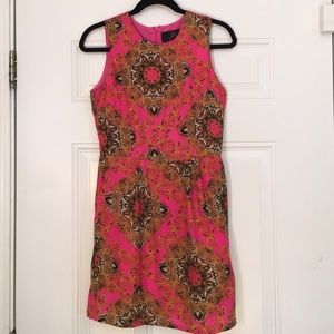 Pink dress with gold and black patterned details
