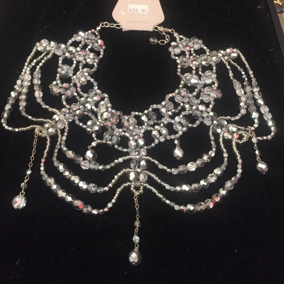 Silver beaded choker type necklace and earrings.