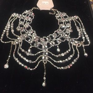 Silver beaded choker type necklace and earrings.