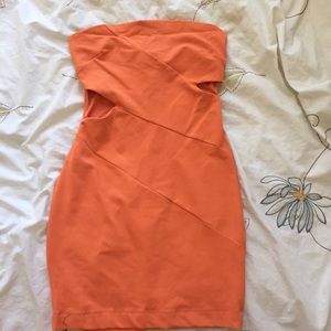 Orange Bebe body con dress with side cut outs