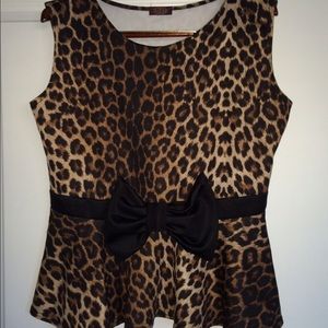 Cheetah print sleeveless peplum top.