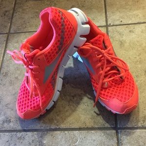 Bright orange Reebok sneakers