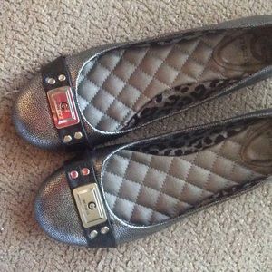 Silver and black flats. Never been worn.