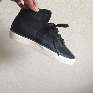 Black globe sneakers