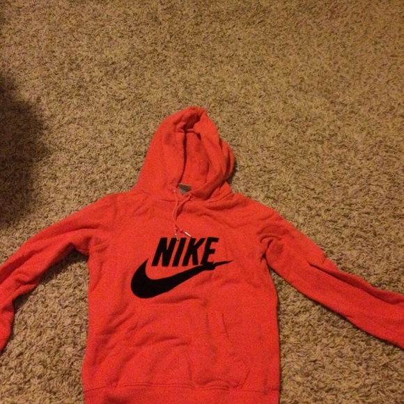 A pinkish red hoodie, Nike, too small on me