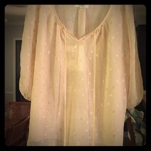 A 3 quarter sleeve see through shirt.