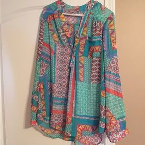 Sheer long sleeve patterned top.