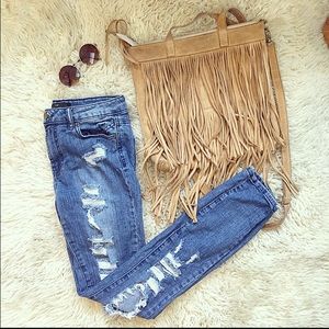 Distressed blue jeans
