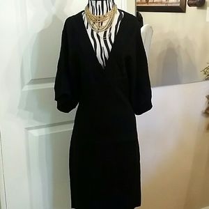 Black bat wing sweater dress with deep V-neck
