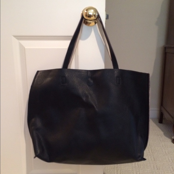 Reversible black and white vegan leather bag
