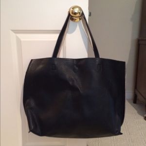 Reversible black and white vegan leather bag