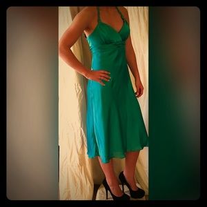 Teal dress with roman style braid around the neck
