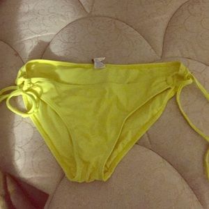 Neon yellow bikini bottom.