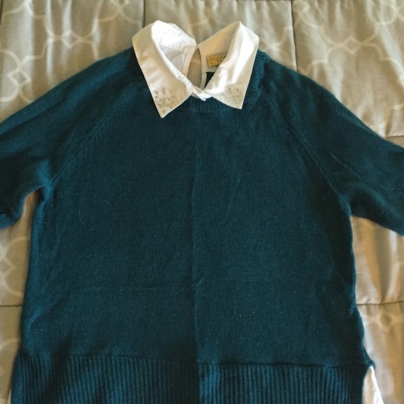 Sweater with built in shirt underneath.