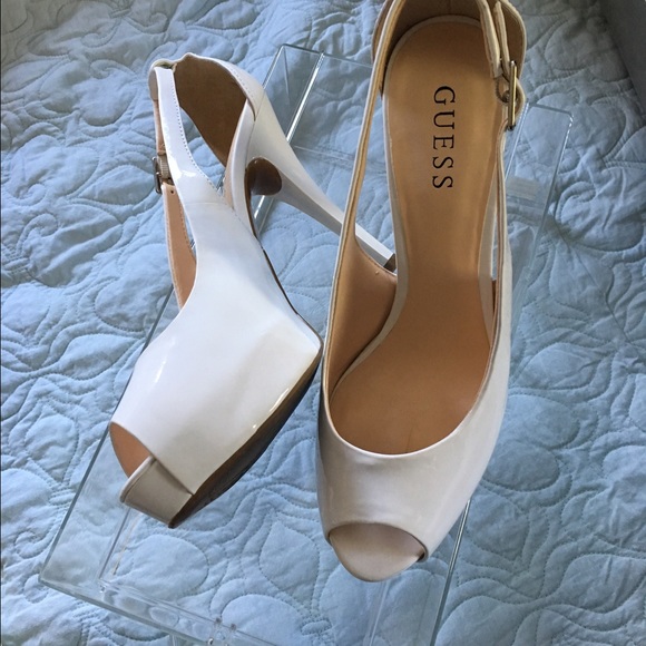 Guess white peep-toe platforms.