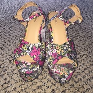 Platform floral heels.