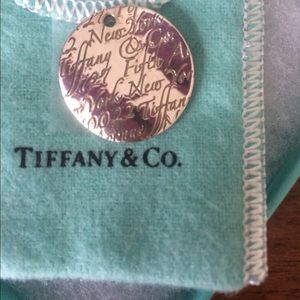 Tiffany's coin necklace with logo engraving.