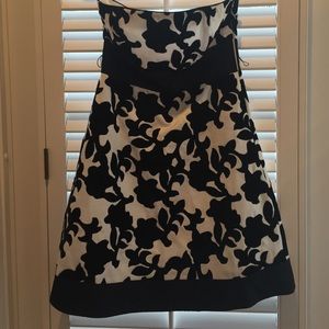 Black and white strapless lined holiday dress.