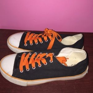 Orange, black, and white sneakers