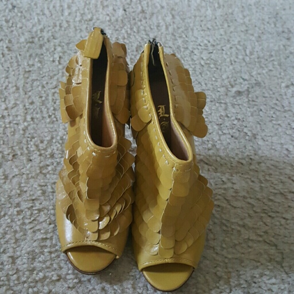 L.A.M.B. Booties back in style. Mustard color