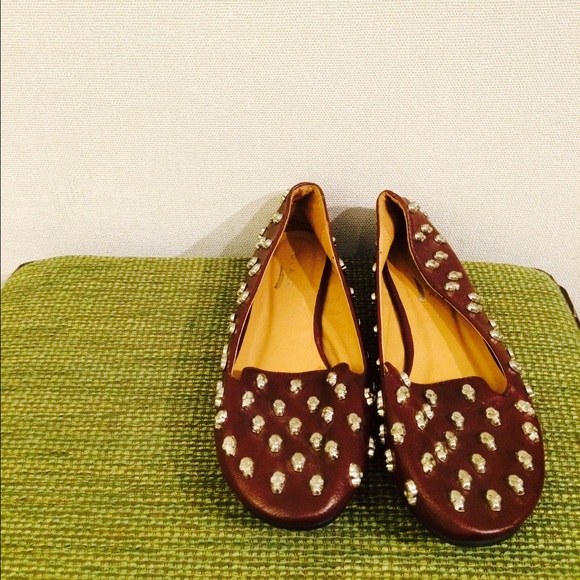 Maroon loafers with silver skull studs