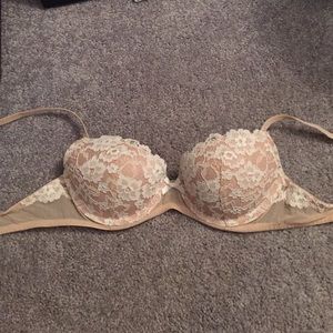 Tan and white lace bra