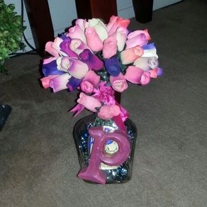 Its a crown royal bottle with roses and a  .P.