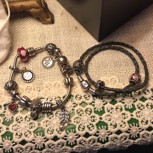 Two pandora bracelets with multiple charms