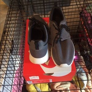 Grey and black roshe runs