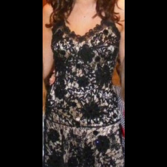 Black lace over nude cocktail dress