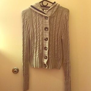 Thick gray sweater with hood.