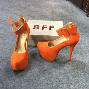 Orange suede pumps