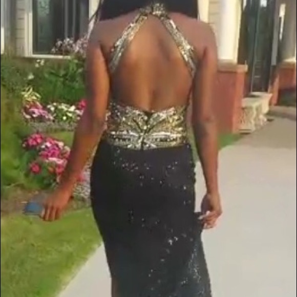 Black, gold and silver sequined dress.
