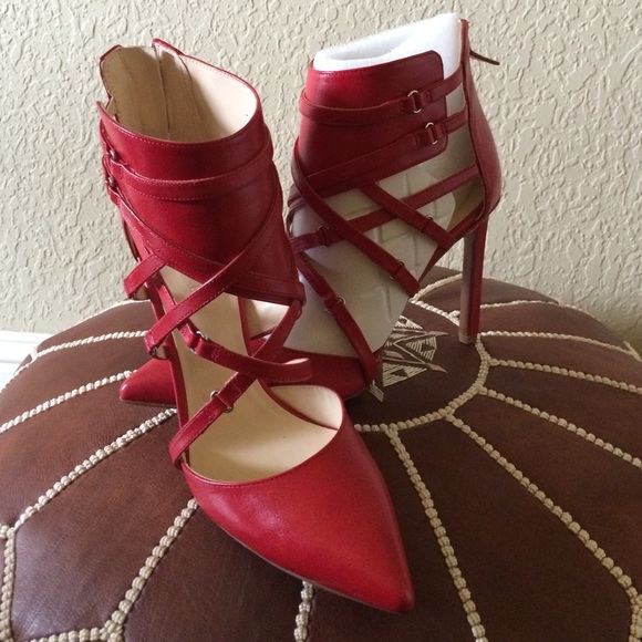 Brand new, never worn Nine West red pumps!