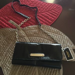 New w/tags. Juicy Couture black leather clutch