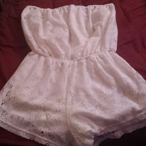 A white lace romper from Charlotte russe
