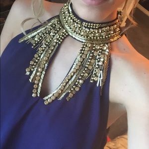 Beautiful navy blue beaded gown with gold accents.