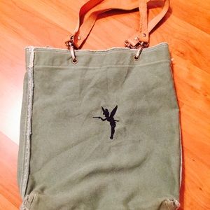 Disney handbag with tinker bell stitched on front.