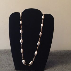 BEAUTIFUL NECKLACE WITH BLUE STONE SETTINGS.