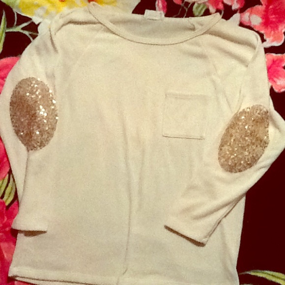 Slouchy cream sweater with sequin elbow patches