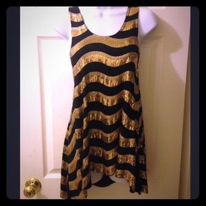 Never worn bebe sequin blk/gold top. Great buy.