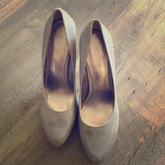 Slate colored, leather Nine West platform pumps.