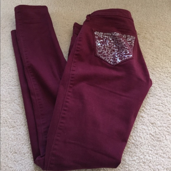 Maroon, sparkly pockets, skinny leg pants.