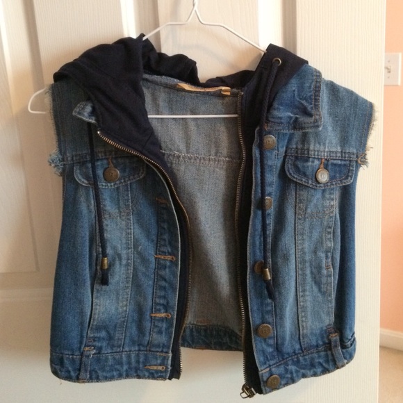 A cropped jean vest with Navy blue hood.